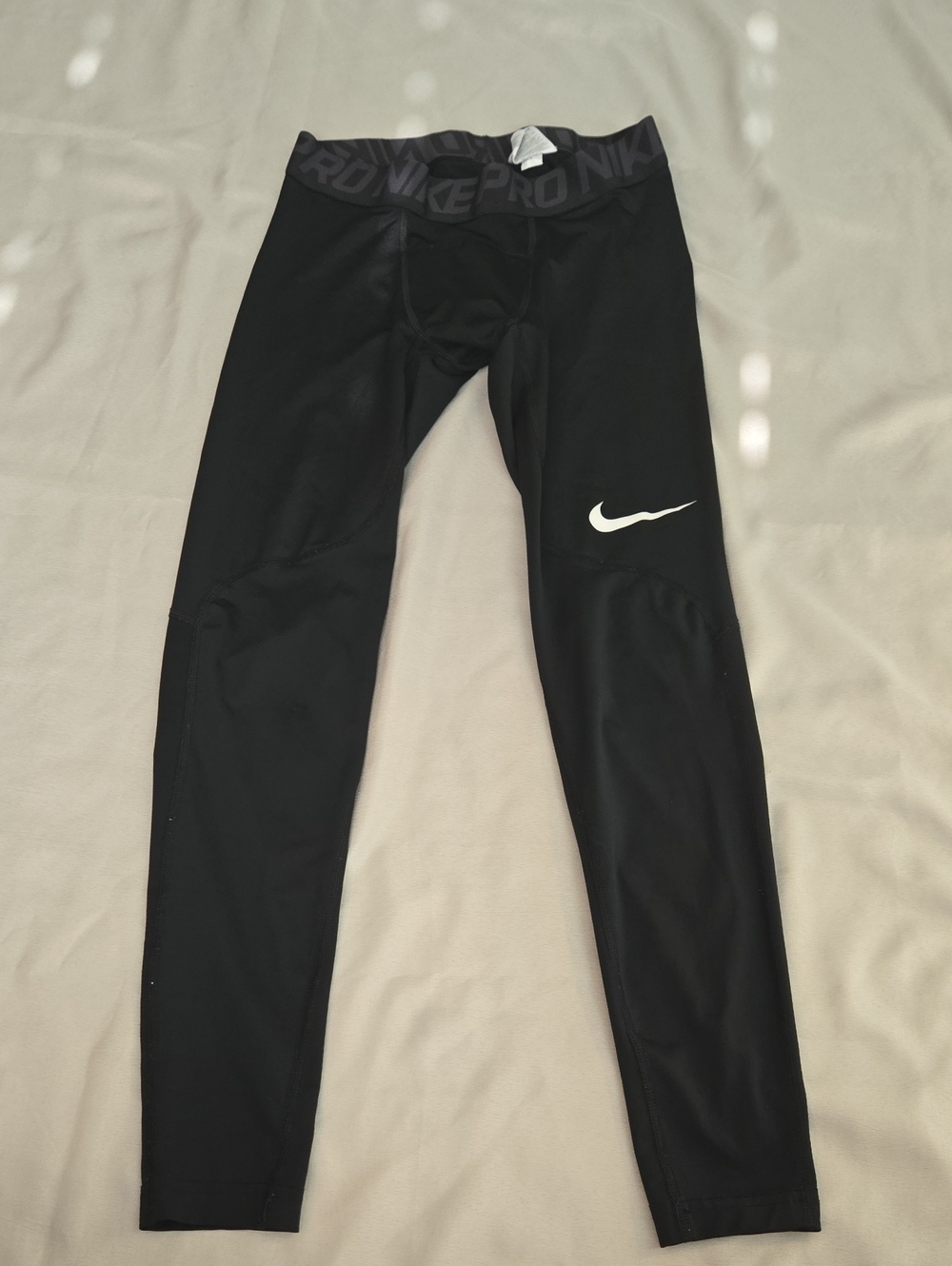 Nike Black Kids' Compression Leggings with White Swoosh